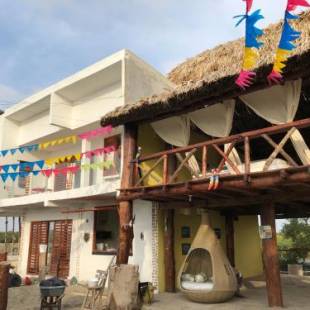 Фотографии гостевого дома 
            Luna Roja casa Frente al Mar y glamping