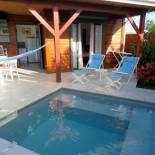 Фотография гостевого дома Fleurs de canne piscines privées