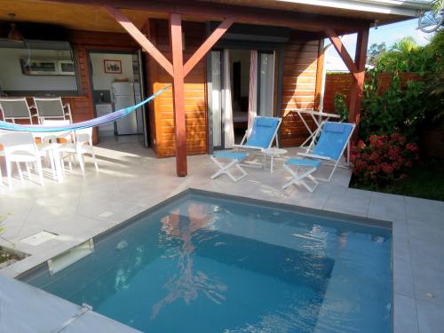 Фотография гостевого дома Fleurs de canne piscines privées