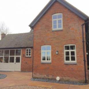 Фотографии гостевого дома 
            Woodleighton Cottages