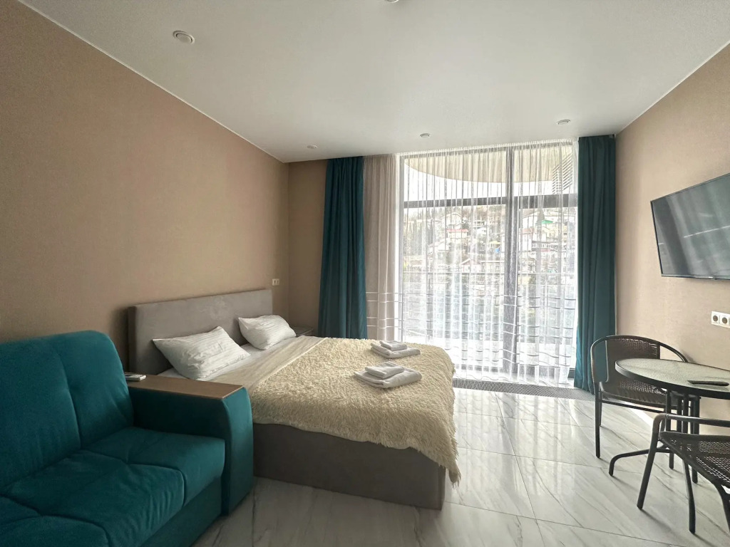 Фотография квартиры Апартаменты LS-Family Comfort с видом на горы и город с 4 этажа