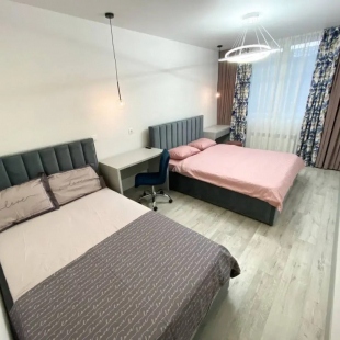 Фотография квартиры Апартаменты двухкомнатные с двумя кроватями, гардеробной и кухней-гостиной