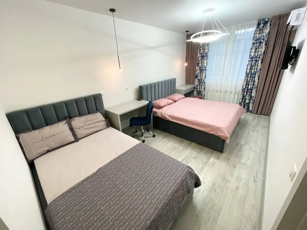 Фотография квартиры Апартаменты двухкомнатные с двумя кроватями, гардеробной и кухней-гостиной