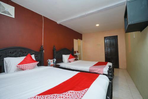 Фотография гостиницы Vaccinated Staff-OYO 927 Carina Hotel