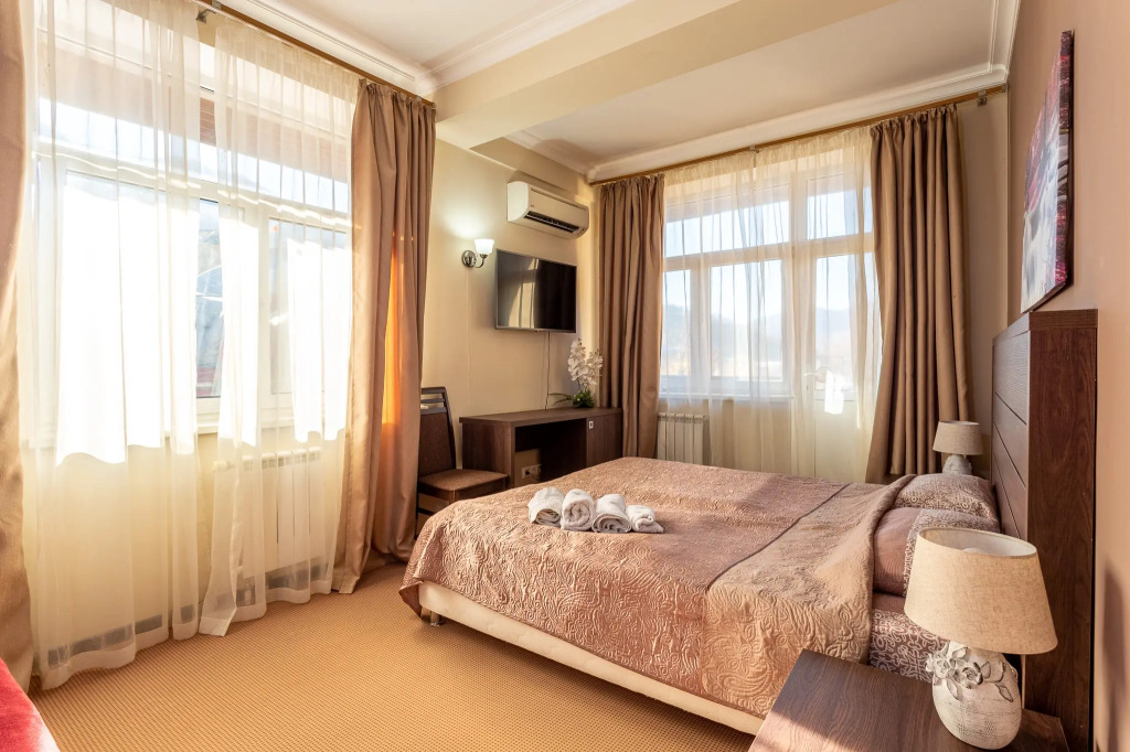 Фотография квартиры Квартира Номер в Отеле с Балконом Шикарным Видом на Горы