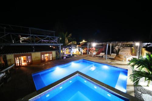 Фотографии гостевого дома 
            Chalé Oásis