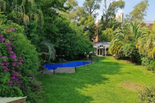 Фотографии гостевого дома 
            Casa con hermoso Jardin, Pileta y Quincho en Pilar