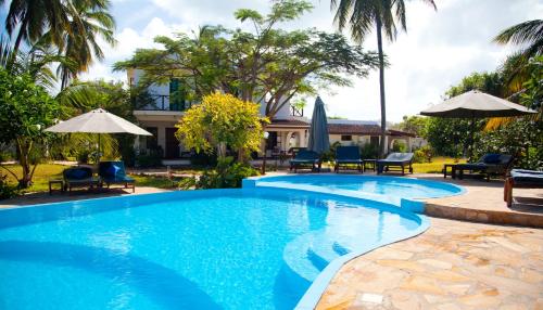 Фотография гостиницы Flame Tree Cottages