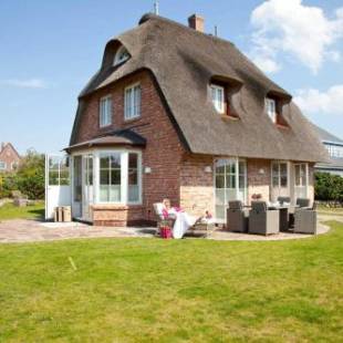 Фотографии гостевого дома 
            Das Reet Strandhaus