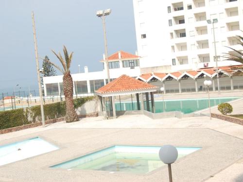 Фотография гостевого дома 5 bedrooms house at A dos Cunhados 50 m away from the beach with sea view shared pool and enclosed garden