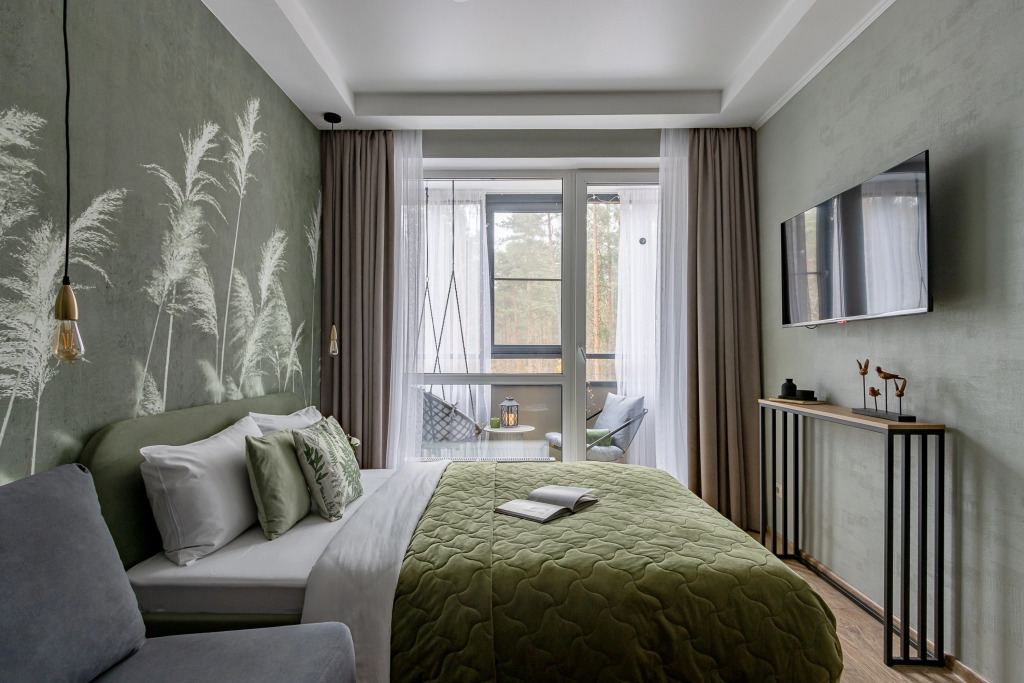 Фотография квартиры Квартира Ютно Колосья с качелью на балконе и видом на сосны в Зеленогорске