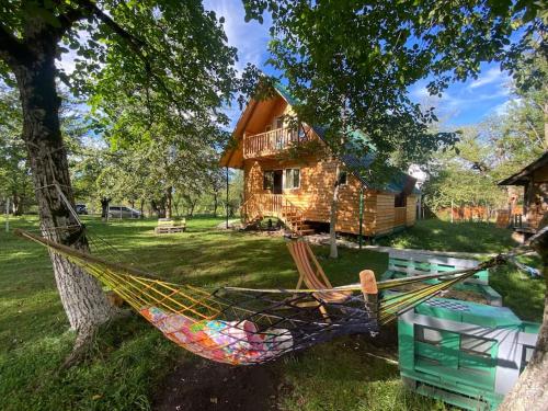 Фотографии гостевого дома 
            Deduleti-a cabin surrounded with pine forest