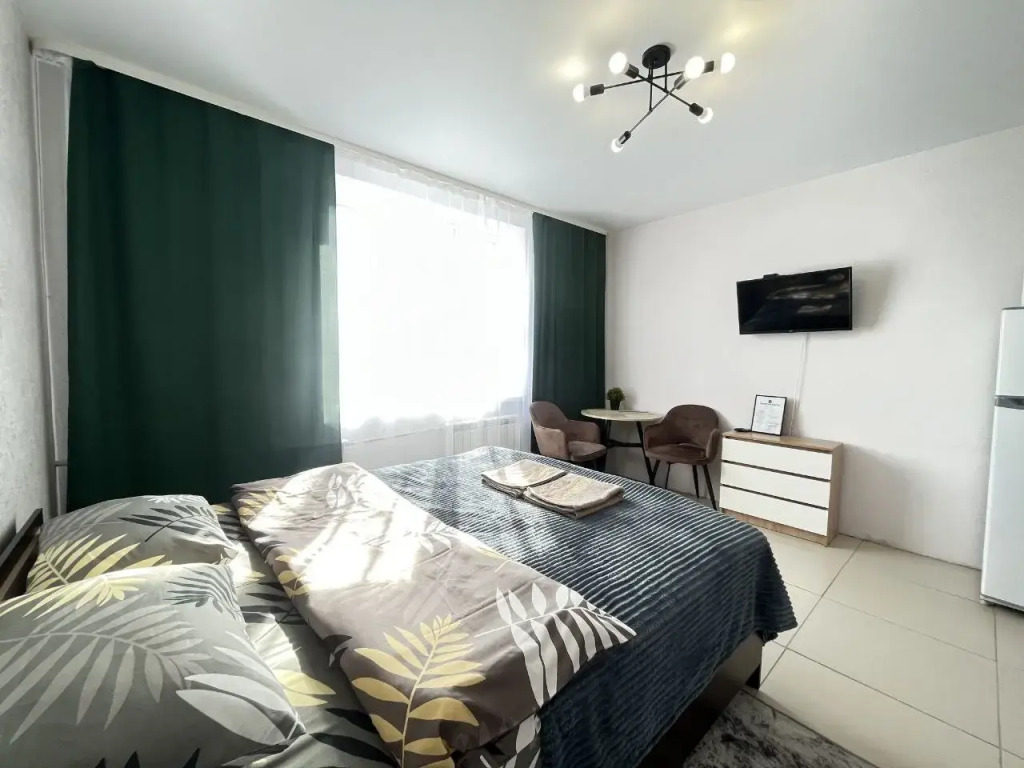 Фотография квартиры Апартаменты студия NHome Изумрудный город