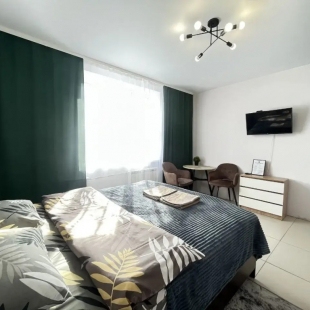 Фотография квартиры Апартаменты студия NHome Изумрудный город