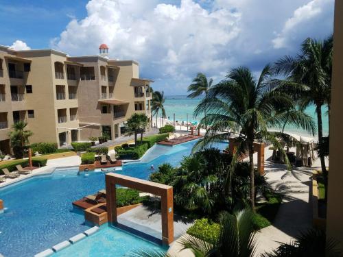 Фотография апарт отеля Ocean Front El Faro Reef 304