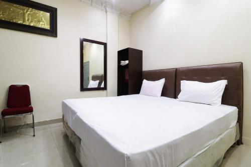 Фотография гостевого дома Utama Syariah