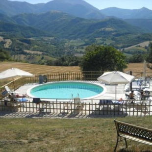 Фотография гостевого дома Inviting Holiday Home in Serra Sant'abbondio with Garden