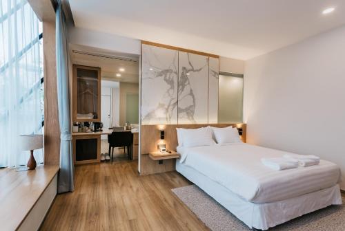 Фотография гостиницы Artino Hotel - SHA Extra Plus