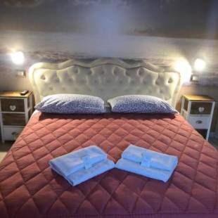 Фотографии гостевого дома 
            B & b Oasis Passion Fiera - Quadruple Room 2