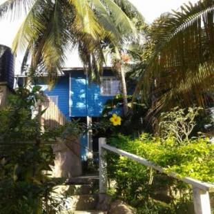 Фотография гостевого дома onelovecottagetobago upstairs apartment