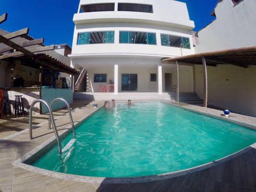 Фотография гостевого дома Casa com piscina e churrasqueira em São Pedro da Aldeia