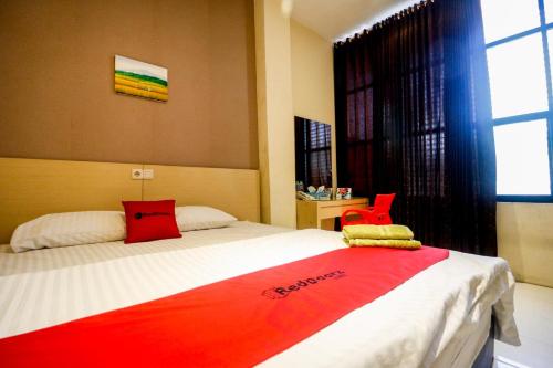 Фотография гостевого дома RedDoorz near Pasar Tarapung Siring Banjarmasin