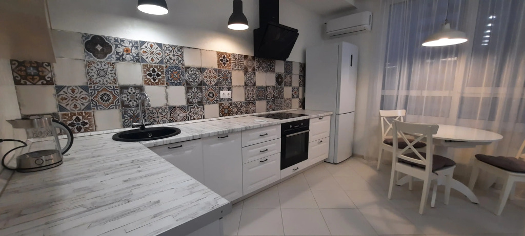 Фотография квартиры Квартира с зонированной гостиной и отдельной спальней