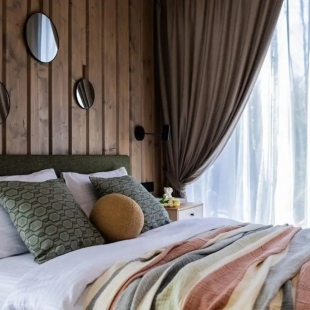 Фотография Коттеджа Пaноpaмный дом в хвойнoм лесу с сaуной