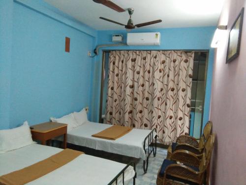 Фотография гостевого дома Pari Residential Lodge - Temple View Hotel