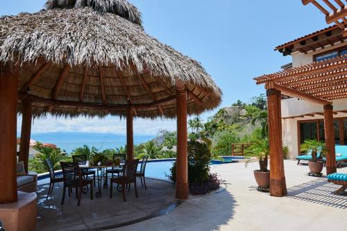 Фотография гостевого дома Happiness comes with every wave! Amazing beach house in five-star beachfront resort