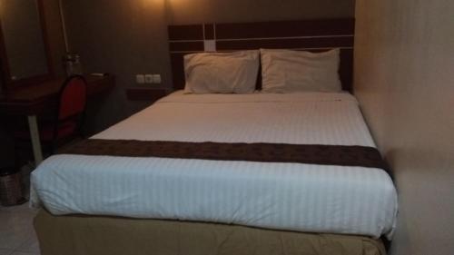 Фотография гостиницы OYO 3936 Hotel Trisula Makassar