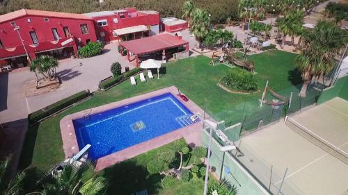 Фотографии гостевого дома 
            Villa de tres casas con padel y piscina