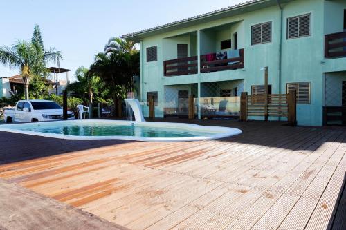 Фотография мини отеля La Ferrugem Suites - 100 mts da Praia