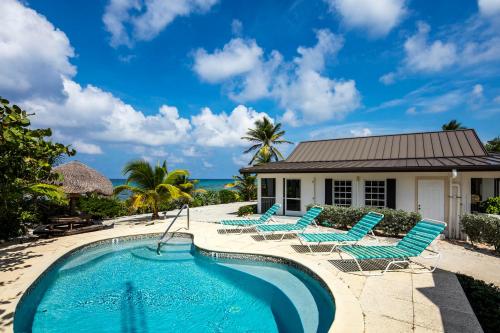 Фотографии гостевого дома 
            Conched Out by Grand Cayman Villas