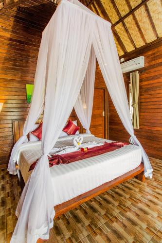 Фотография базы отдыха Mimpi Cottages