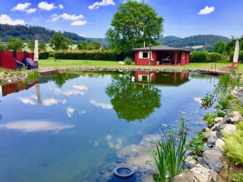 Фотография гостевого дома Romantic Wooden Lodge,Sauna,Schwimmteich,alleinstehend,absolut ruhig