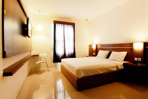 Фотография гостиницы Alzara Hotel Syariah