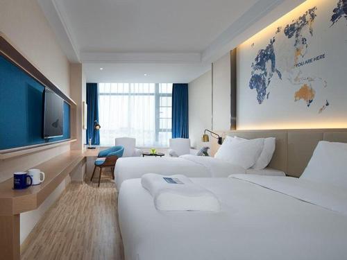 Фотографии гостиницы 
            Kyriad Mavelous Hotel Shantou Gurao