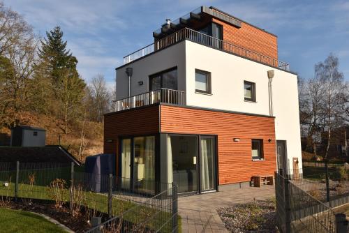 Фотографии гостевого дома 
            Luftkurort - 5 Sterne Ferienhaus - See-Kamin-Sauna-Garten