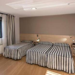 Фотографии гостиницы 
            Hotel Puerta de la Santa