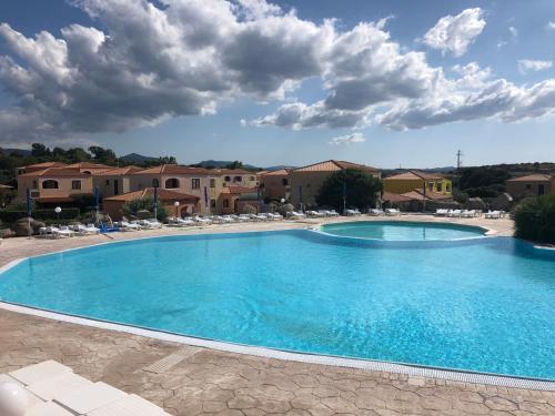 Фотографии гостевого дома 
            Appartamento villaggio Mirice con piscina