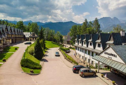 Фотография гостевого дома Kompleks Pensjonatów Antałówka