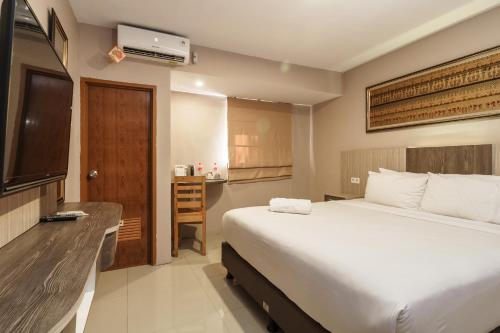 Фотография гостиницы RedDoorz Syariah near Kebun Raya Liwa