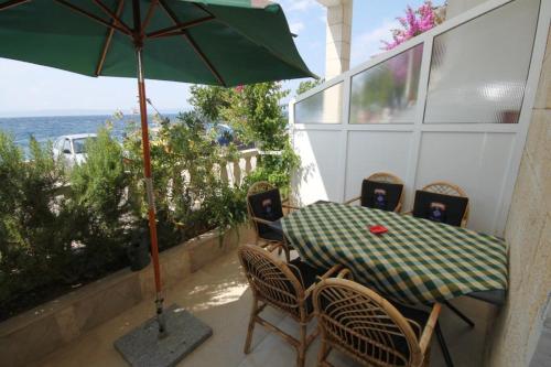 Фотография гостевого дома Apartments by the sea Podgora, Makarska - 6713