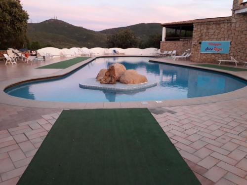 Фотографии апарт отеля 
            Monolocale Arianna con giardino privato e piscina