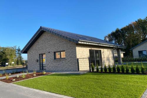 Фотография гостевого дома Ferienhaus am Harkebrügger See mit Sauna Haus Louis