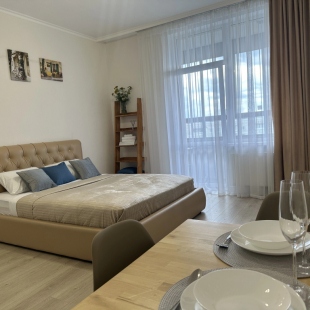 Фотография квартиры Квартира Просторная уютная и современная студия на Родонитовой 35