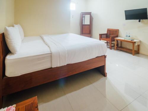 Фотография гостиницы OYO 1487 Residence Khoe Near RS Royal Taruma