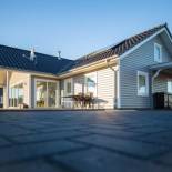 Фотография гостевого дома Dänisches Blockhaus direkt am Wangermeer