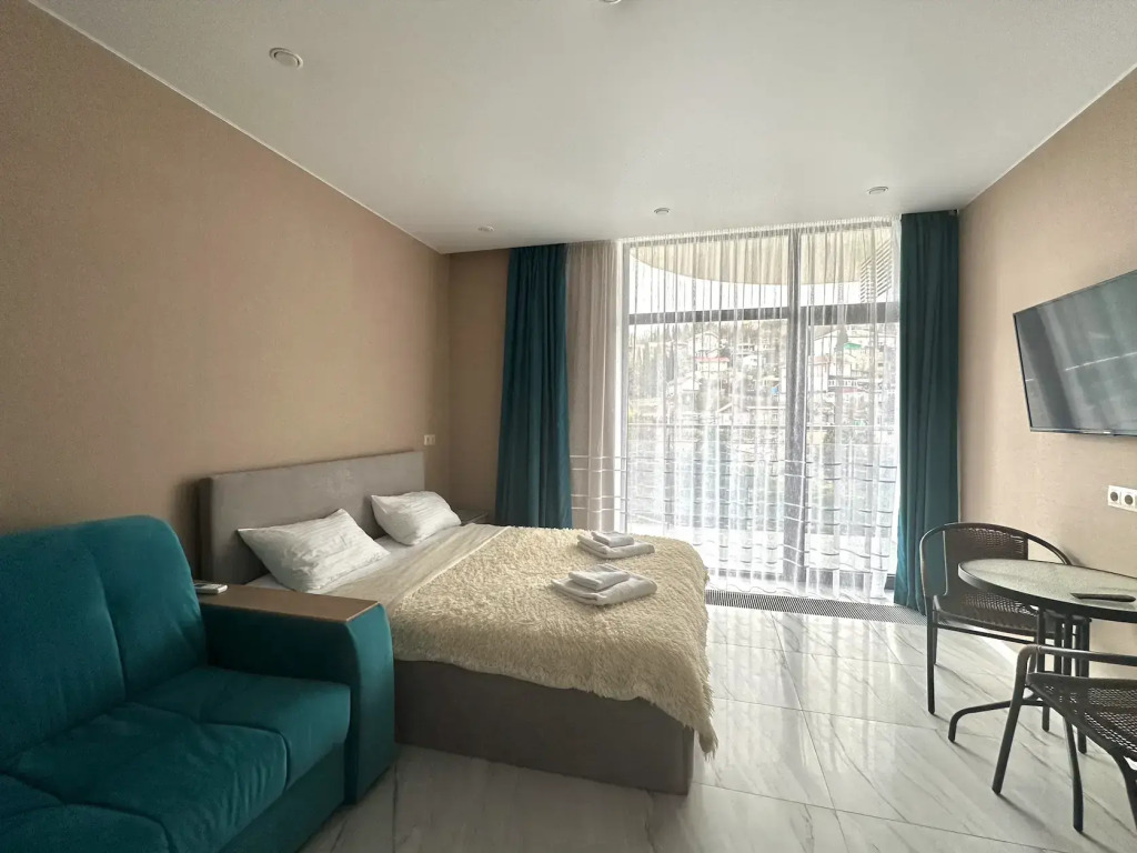 Фотография квартиры Апартаменты LS-Family Comfort с видом на горы и город с 4 этажа